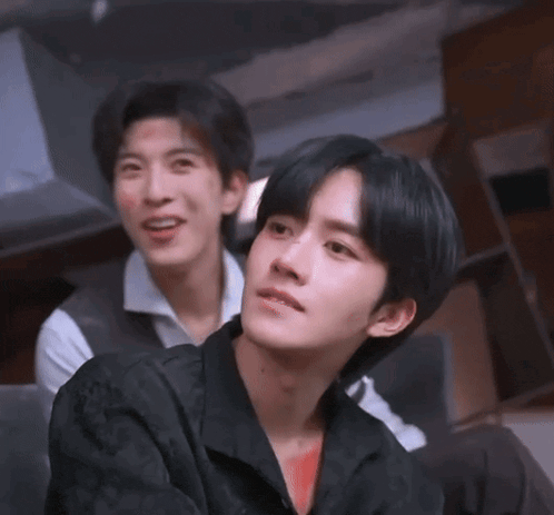 a man in a black shirt with chinese writing on it