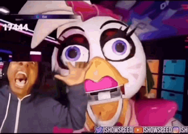 a man in a chicken mask is making a funny face .