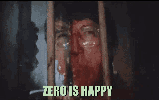 a man with glasses behind bars with the words zero is happy below him