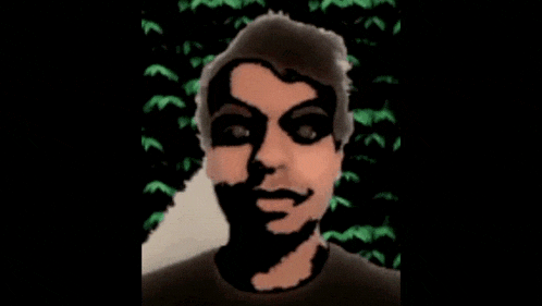 three images of a man 's face with black paint on his face