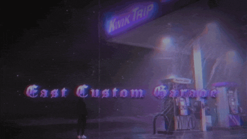 a person standing in front of a kwik trip gas station that says east custom garage