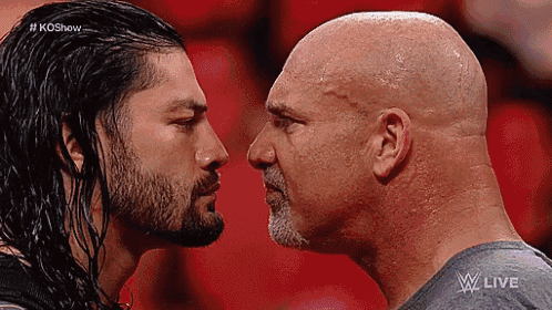 two men are looking at each other in a wrestling match and the words w live are on the bottom of the screen