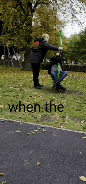 a person holding a green balloon in a park with the words when the written below