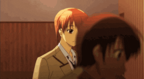 a man with red hair is standing next to a woman