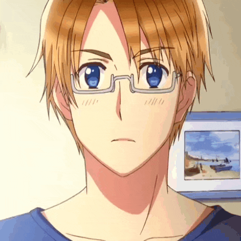 a young man wearing glasses and a blue shirt