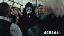 a person wearing a scream mask is on a bus