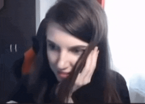 a close up of a woman talking on a cell phone .