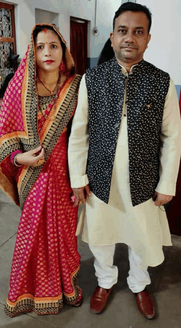 a man and a woman are posing for a photo