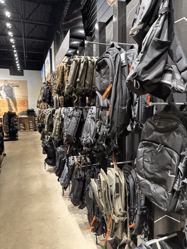 a display of backpacks in a store with one that says 5.11 on it