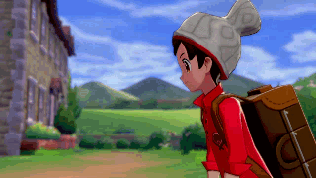 a boy in a red shirt and a white hat is carrying a brown suitcase