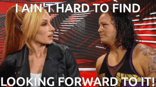two women are sitting next to each other with the words i ain 't hard to find looking forward to it