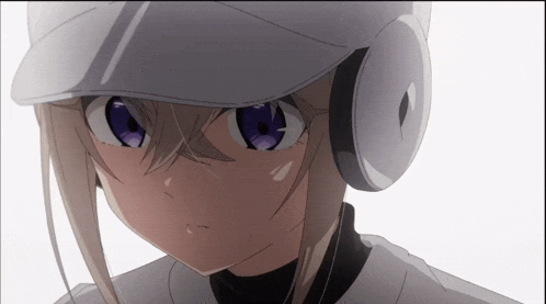a close up of a baseball player wearing headphones and a hat