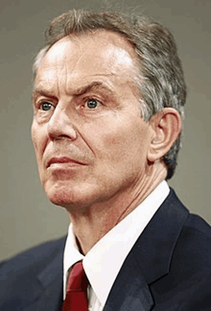 a man in a suit and tie is looking to the side