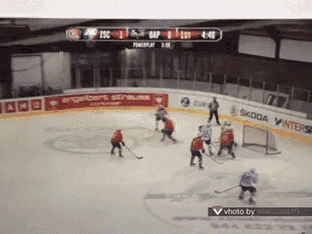 a hockey game is being played on a skoda winters sponsored ice rink