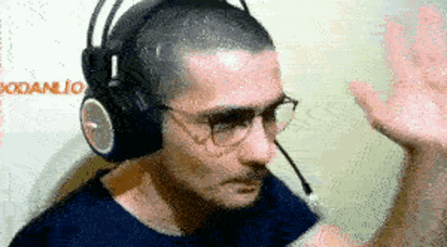 a man wearing headphones and glasses with the word danlio behind him