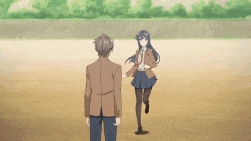 a girl in a school uniform is holding a boy 's arm and says ow