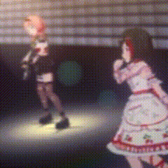 a blurred image of a girl singing into a microphone