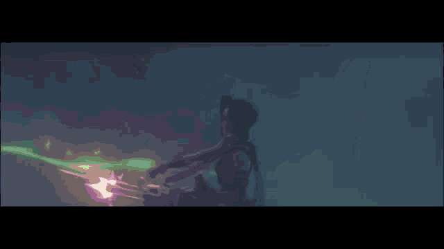 a purple light is coming out of a dark tunnel