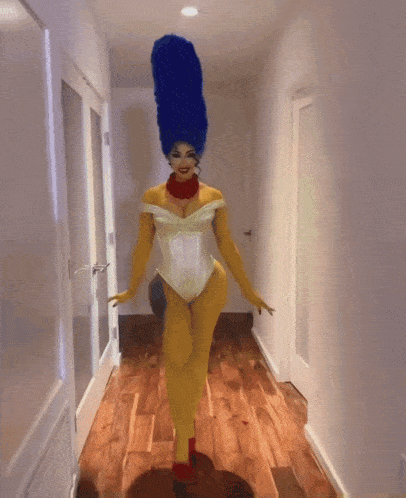 a woman dressed as marge simpson with blue hair