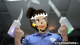 a man in a blue shirt is holding a pair of knives with a pixelated face on his face
