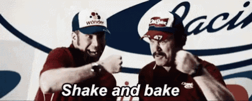 two men are standing next to each other and one of them is wearing a hat that says wonder on it