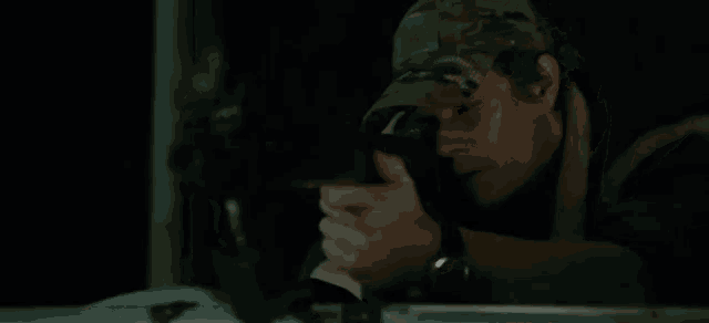 a man is taking a picture with a camera .