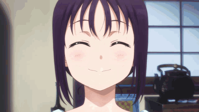 a close up of a girl 's face with a smile on her face