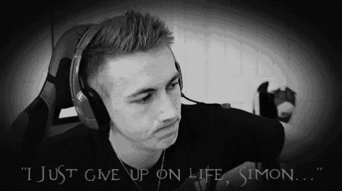 a man wearing headphones with the words " i just give up on life simon "