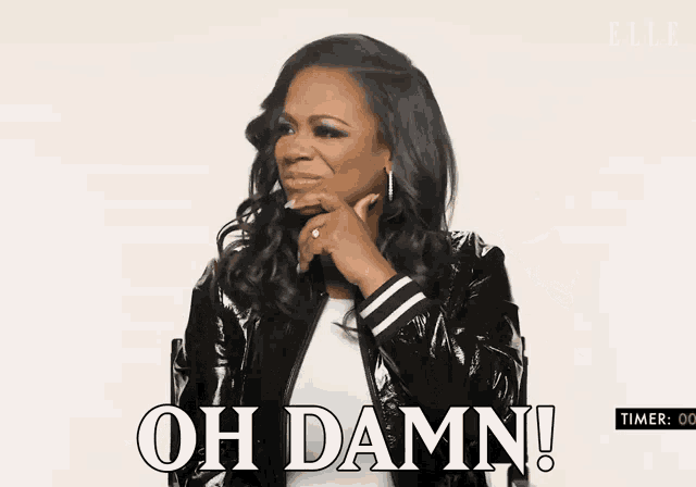 a woman in a black jacket with the words oh damn on the bottom
