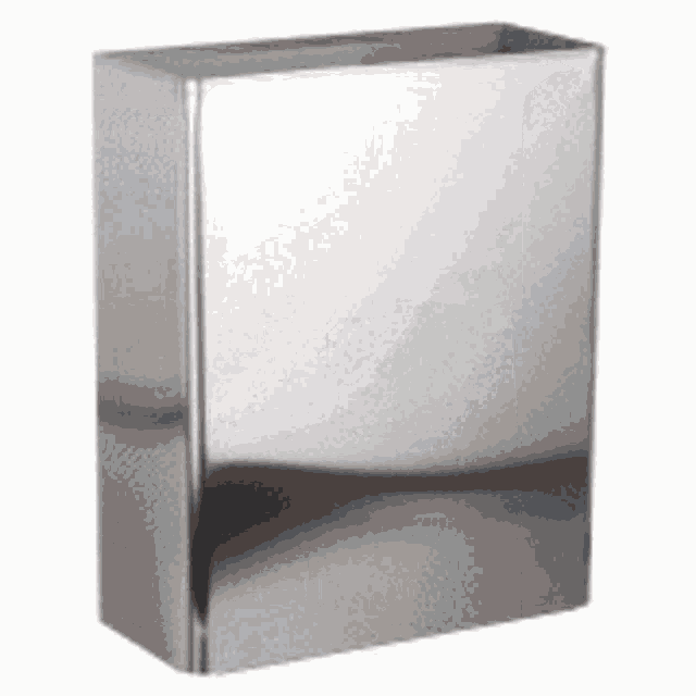 a stainless steel trash can is sitting on a white table .