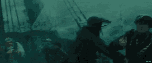 a man in a hat says " just kiss " in front of a ship