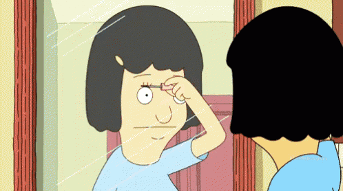 a cartoon woman is looking at herself in the mirror