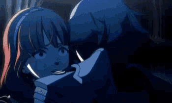 a person is standing in a dark room with a blue light shining on their feet .