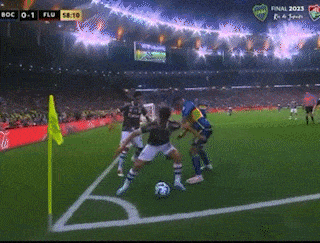 a soccer game is being played in a stadium and the score is 1-0