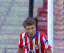 a soccer player wearing a red and white striped jersey with the letters m on the front