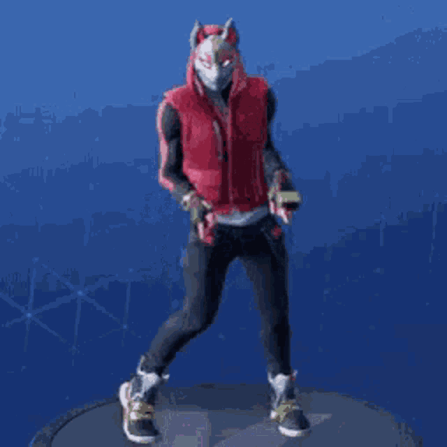 a man in a red vest and black pants is dancing in front of a blue sky .