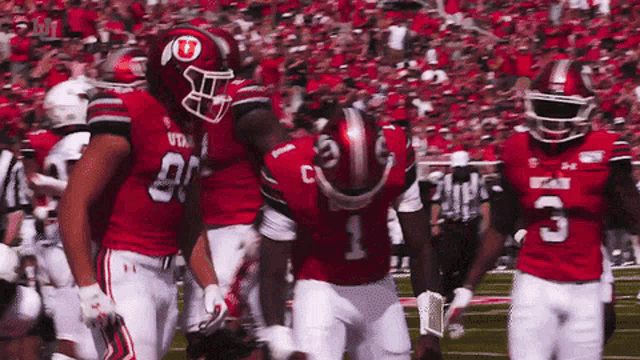 a football player wearing a helmet with utah on it