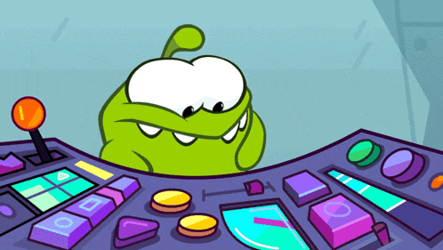 a green cartoon character is sitting at a purple table with buttons that say l and o