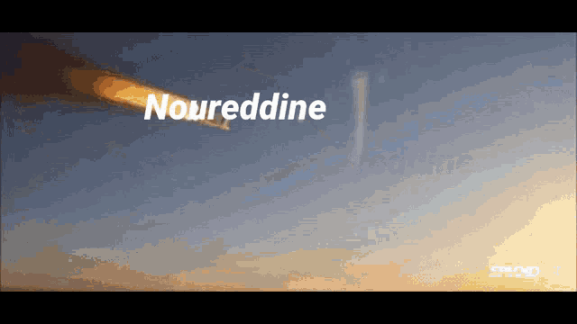 a rocket is flying through the air and the word noureddine is visible