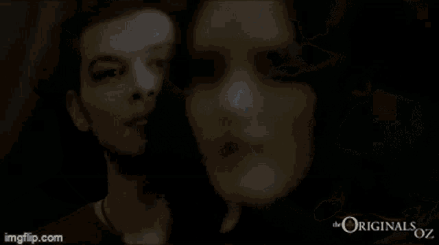 a man is laying in a dark room with the words the originals oz written on the bottom