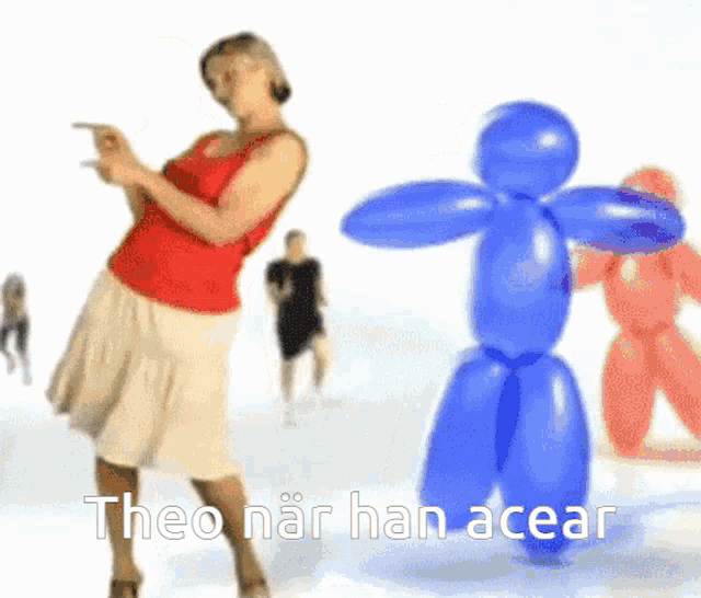 a woman is dancing in front of a blue balloon that says theo