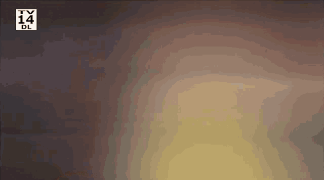 a blurred image of a tv 14 logo on a dark background .