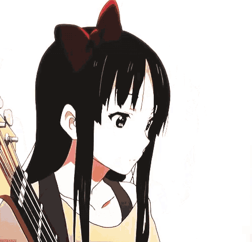 a girl with long black hair is holding a fender guitar on her back .