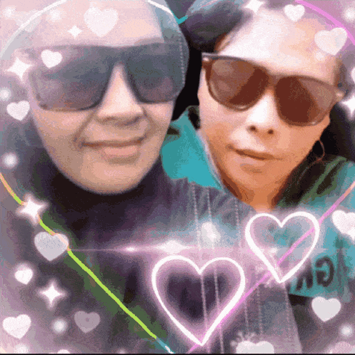 a man and a woman wearing sunglasses are standing next to each other with hearts around them