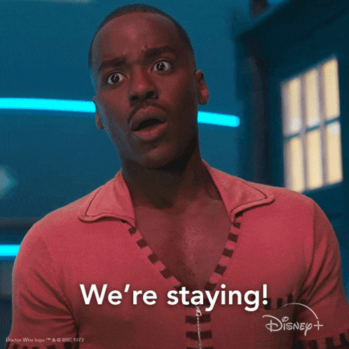 a man in a pink shirt says we 're staying on disney +
