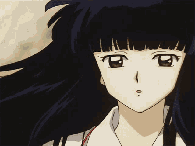 a close up of a girl 's face with a white shirt on