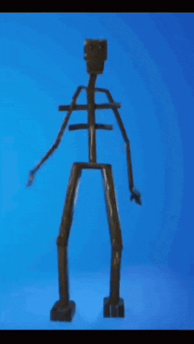 a wooden skeleton with arms and legs against a blue backdrop