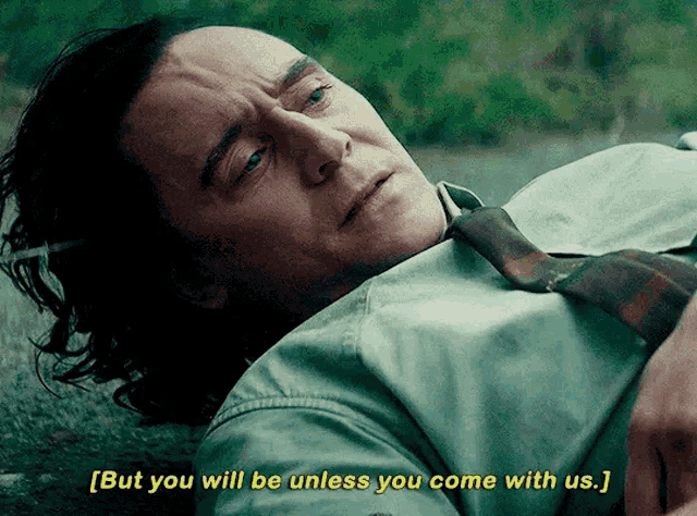 a man in a tie is laying on the ground with the words but you will be unless you come with us