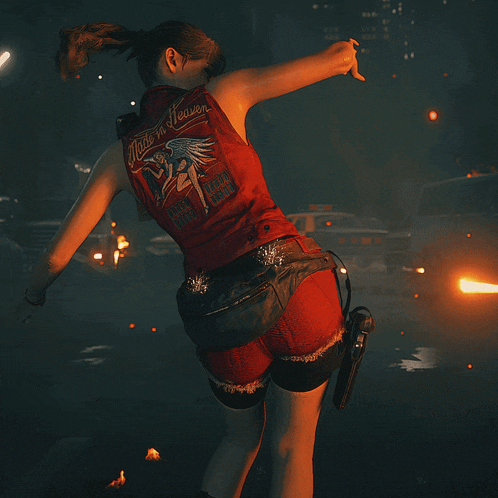 a woman in a red vest that says just n heaven
