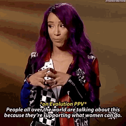 a woman with purple hair is talking about women 's support